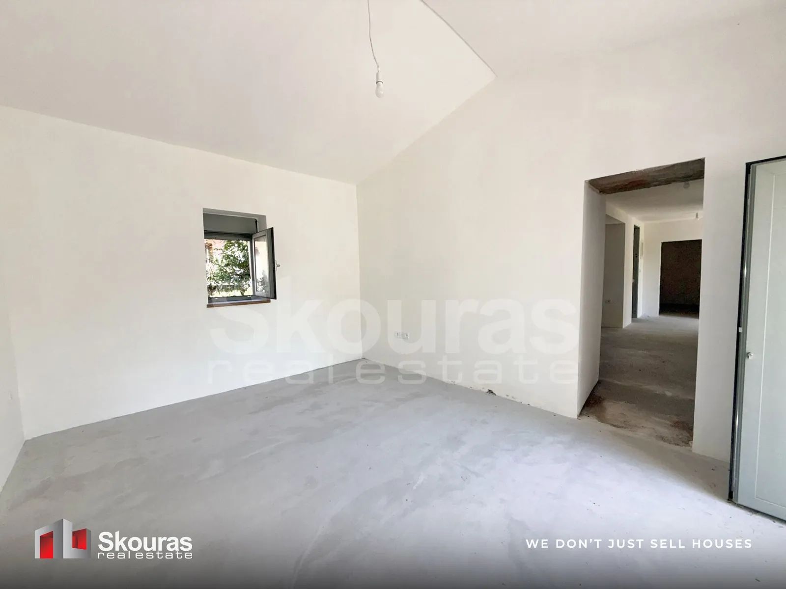 Bedroom with a new window in the house in Ammos, Messinia