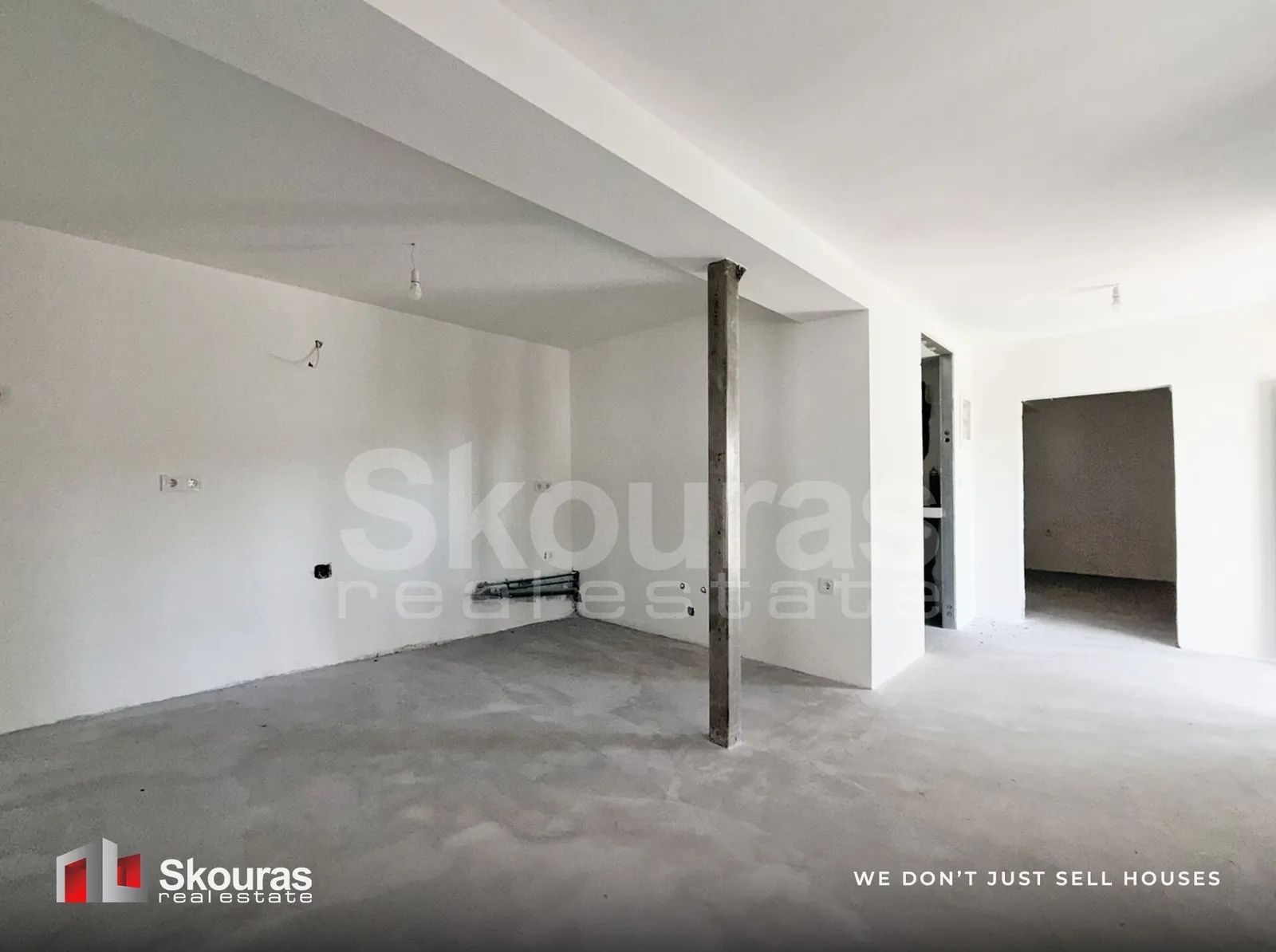 Open-plan ground-floor living space of the Ammos house, ready to finish